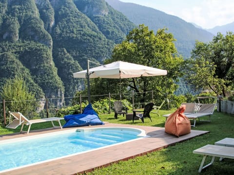 Water, Mountain, Swimming Pool, Plant, Green, Tree, Shade, Sky, Outdoor Furniture, Cloud