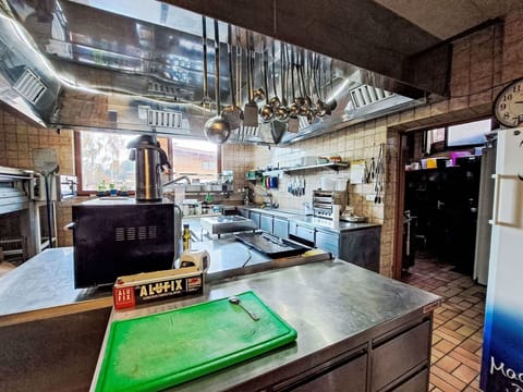 Kitchen, Countertop, Lighting, Interior Design, Ceiling, Kitchen Appliance, Kitchen Stove, Major Appliance, Light Fixture, Cabinetry