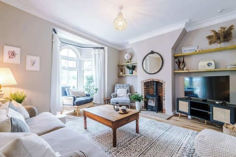 Pure boutique comfort. A massive, light-filled living space complete with a traditional log burner for cozy evenings.