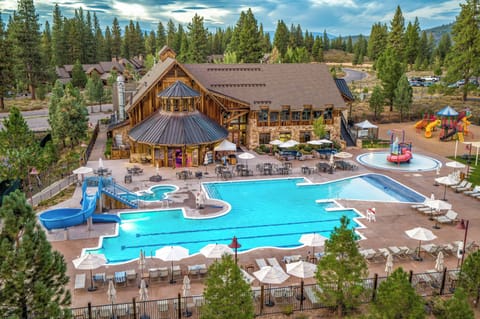 The Pavilion features two pools - one seasonal and one year-round, two year-round hot tubs and in the summer months a water slide, a kid's splash pad, and outdoor playground.