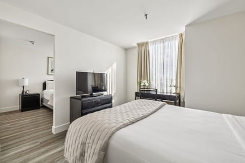 Deluxe Two Queen Suite | Individually furnished, desk, laptop workspace, blackout drapes