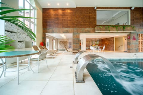 Indoor pool, open 10:00 AM to 10:00 PM, sun loungers