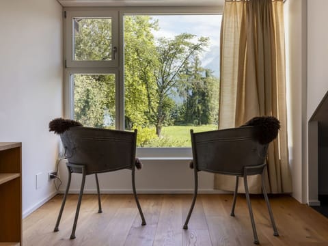 Furniture, Table, Window, Comfort, Shade, Building, Wood, Chair, Textile, Architecture
