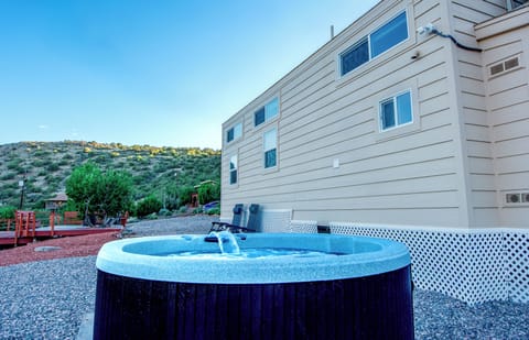 Private hot tub, vineyard views, and lounging area
