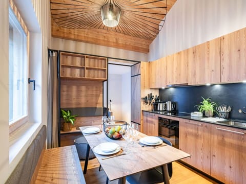 Table, Property, Furniture, Cabinetry, Wood, Lighting, Interior Design, Window, Countertop, Flooring