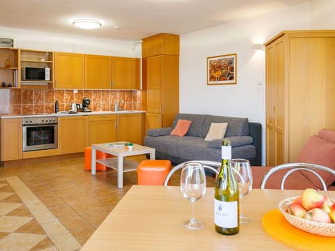 Table, Furniture, Property, Couch, Bottle, Orange, Tableware, Wood, Picture Frame, Interior Design