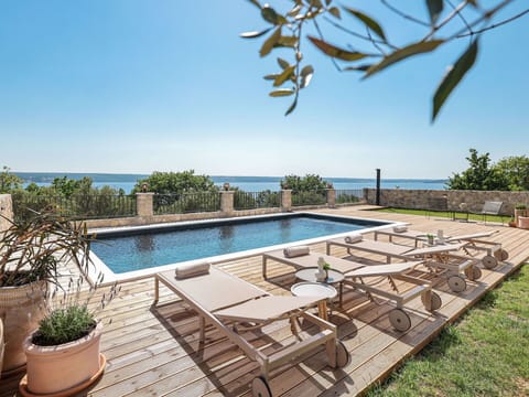 Sky, Water, Plant, Property, Azure, Swimming Pool, Outdoor Furniture, Shade, Wood, Leisure