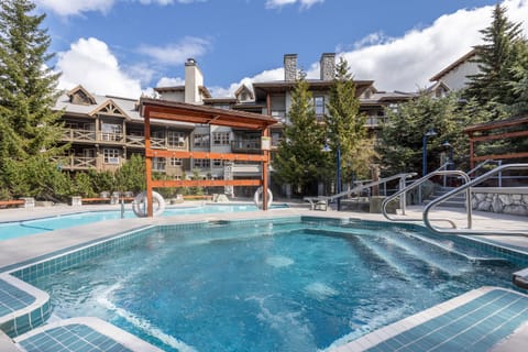 Spacious outdoor pool and hot tub, perfect for a summer escape.
