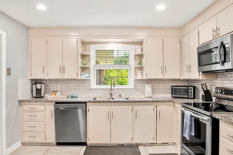 Fully stocked kitchen with sleek stainless steel appliances, ready for all your cooking needs.