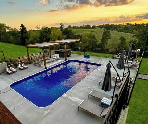 Relax and rejuvenate at our serene retreat! Enjoy breathtaking views from the pool by day and melt your cares away in the hot tub while soaking up unforgettable sunsets. Your perfect getaway awaits! Pool Open April 1st - November 15th