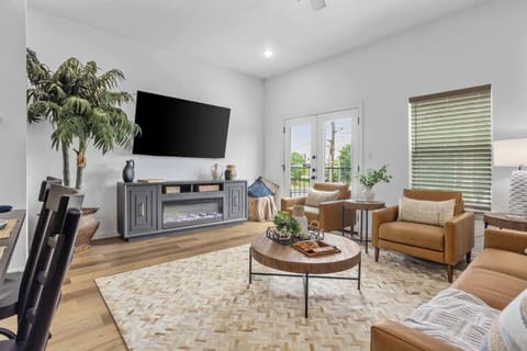 Unwind in a stylish living room with sleek furnishings and inviting seating, the perfect retreat after a day of excitement in Arlington's entertainment district.