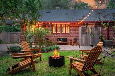 Cozy brick cottage with firepit and patio.