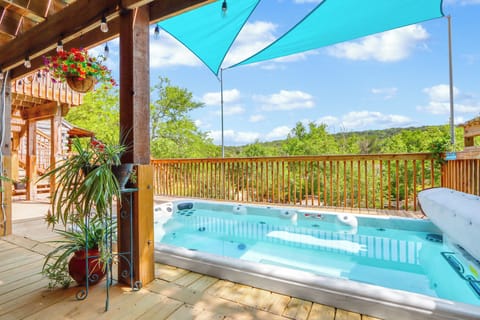 Relax in the oversized hot tub with Hill Country views