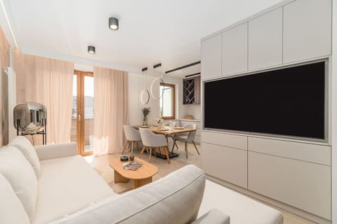 Comfortable Living Room with Sofa Bed and Smart TV | Book Now with RENTUJEMY