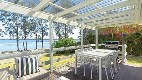Enjoy breezy waterfront views right from the covered patio