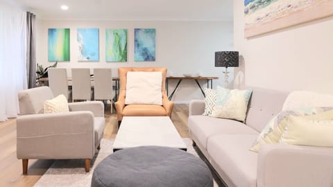 Bright, breezy, and beautifully curated. Bring a touch of seaside serenity into your daily routine with cozy textures, a sleek coffee table, and an atmosphere made for ultimate comfort.