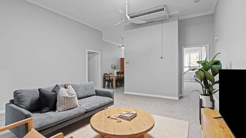A wide-open living room that feels calm, comfortable, and inviting.