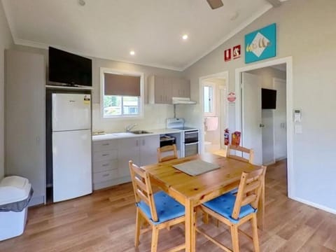 Standard 2 Bedroom Cabin | Living area | 40-inch TV with satellite channels