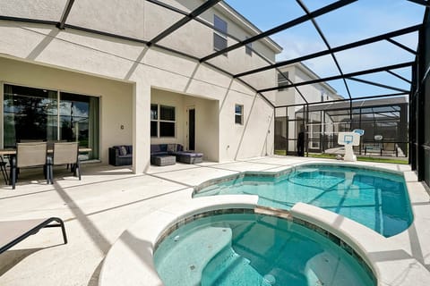 Private screened-in pool and spa with a safety fence for peace of mind