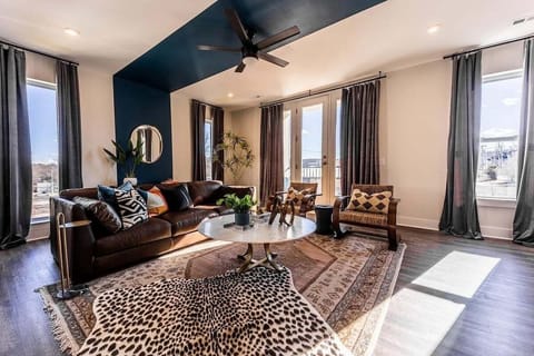 Open concept living area with comfortable seating and TV