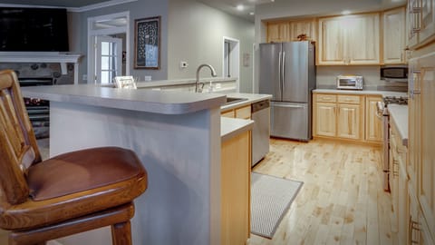 Full kitchen stocked with k-cups, sugar, creamer, olive oil, salt and pepper