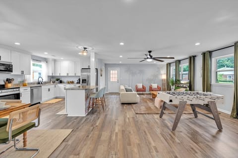 Open floor plan concept featuring the living room, dining, and kitchen