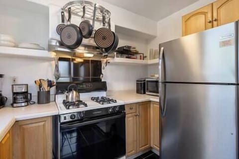 Kitchen includes a stove, fridge/freezer, and all the needed small appliances. 