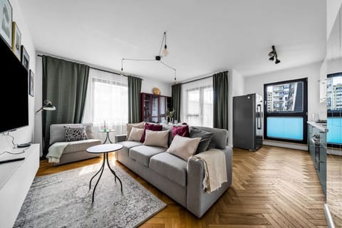 Comfortable Living Room with Sofa Bed and Smart TV | Book Now with RENTUJEMY