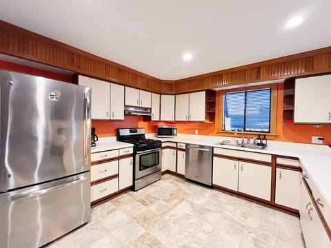 Well-equipped kitchen with ample counter space and storage.