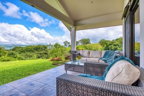 The front patio in front of the primary bedroom.  Enjoy cocktails and charcuterie while listening to the birds and watching them fly from tree to tree.  The creek side is also known to be the route for the howler monkeys to travel.  
