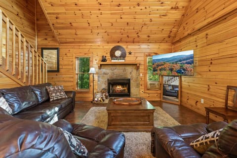 Living area with ample seating, Smart TV, and fireplace