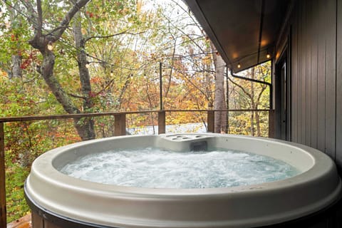 Elevated tranquility Treehouse deck with hot tub and panoramic views