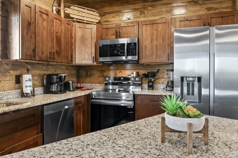 The inviting, open kitchen offers ample space & all the comforts of home