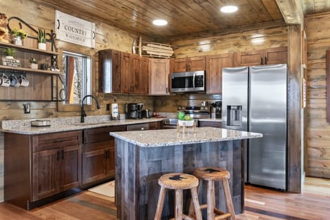 The inviting, open kitchen offers ample space & all the comforts of home