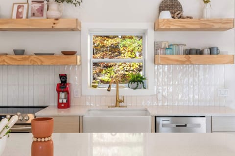 The chic, open kitchen offers loads of room & every home comfort