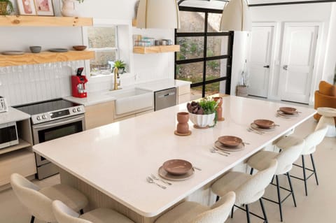 Enjoy mealtimes together at the spacious kitchen island, seating 6