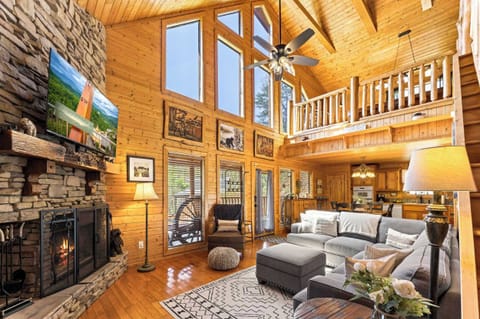 Cozy and spacious living area with TV and fireplace
