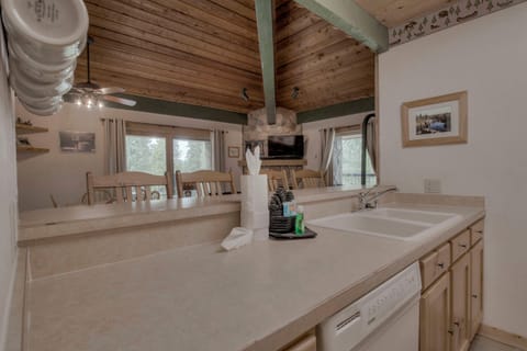 Kitchen with toaster, drip coffee maker, blender, slow cooker, and more