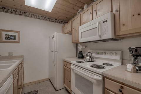 Kitchen with toaster, drip coffee maker, blender, slow cooker, and more