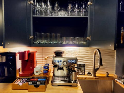 “Gourmet Coffee Bar with Breville Espresso Machine”
Start your mornings—or end your evenings—with a café-style coffee bar featuring a Breville espresso machine, Keurig, and ninja drip coffee maker.