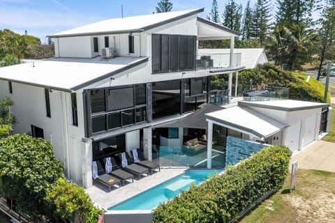 This three-storey home has it all! From a sparkling pool to incredible ocean views just steps from your door.