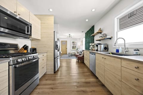 Kitchen: Whip up your favorite meals in this fully equipped kitchen — where modern amenities meet homey charm for a seamless cooking experience.