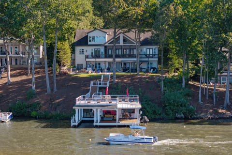 Boathouse with House in Background.
Optional Hurricane 226 Fun-deck boat shown