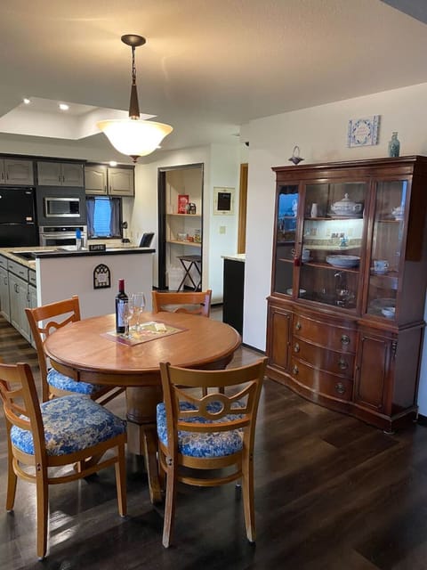 The dining area is adjacent to the kitchen for easy serving!