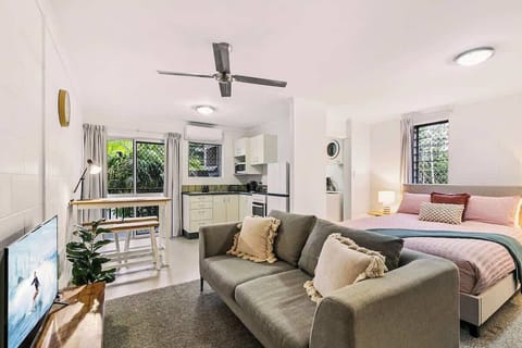 The open-plan studio layout blends living, dining, and sleeping spaces into one easy-flowing retreat, with air conditioning and natural light adding to the peaceful atmosphere.
