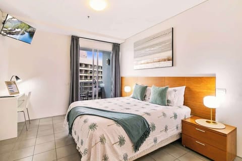 Sink into the queen bed after a day of exploring, with calming interiors and natural light creating a peaceful retreat by the marina.