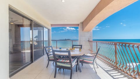 Exceptionally spacious balcony hugs two sides of the condominium, putting you in touch with the beach outside.