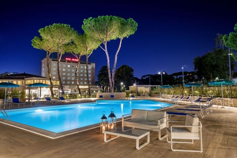 Seasonal outdoor pool, open 9:30 AM to 6:30 PM, pool umbrellas