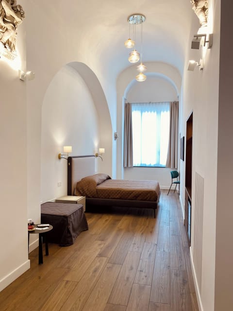 Classic Triple Room, Courtyard View | Down comforters, blackout drapes, soundproofing, free WiFi