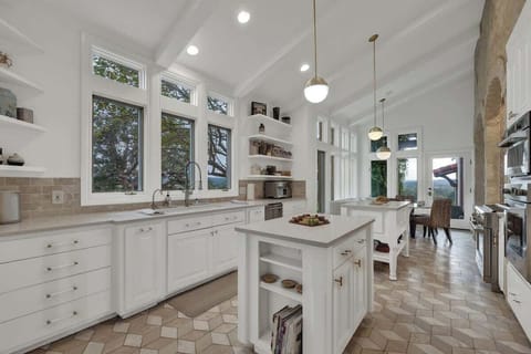 The natural light floods through the kitchen windows